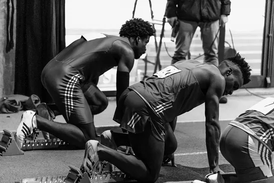 Black and white photos of track runners at starting blocks