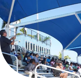 Male athletes in mid-run.